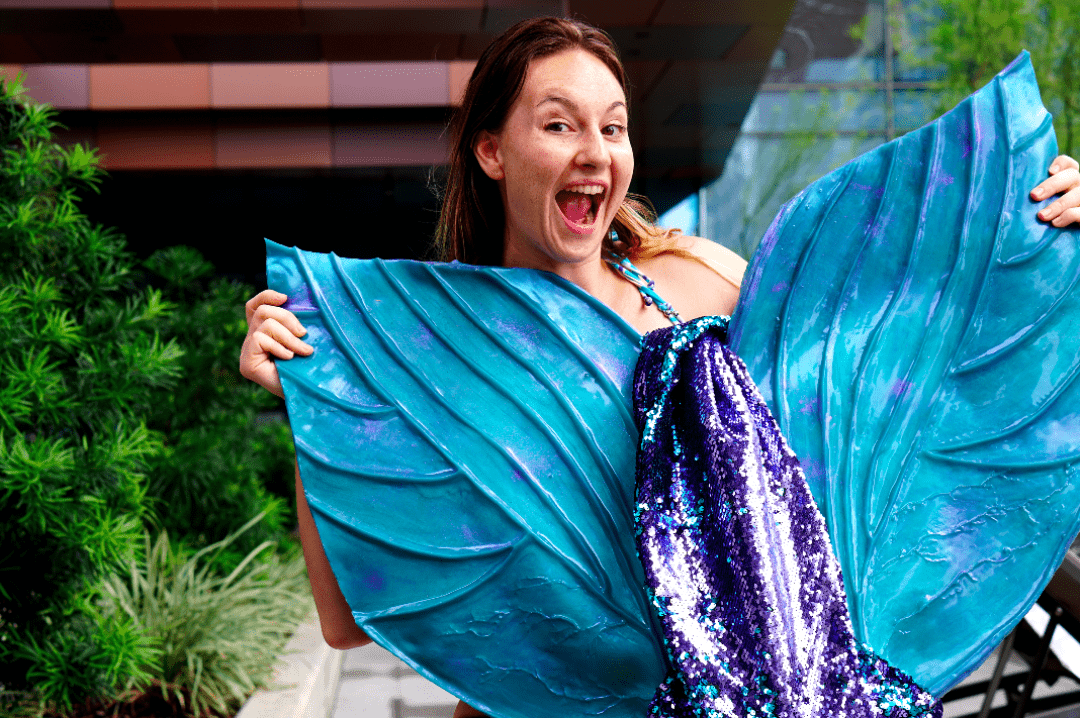 Sequin mermaid tail made with teal blue silicone tail