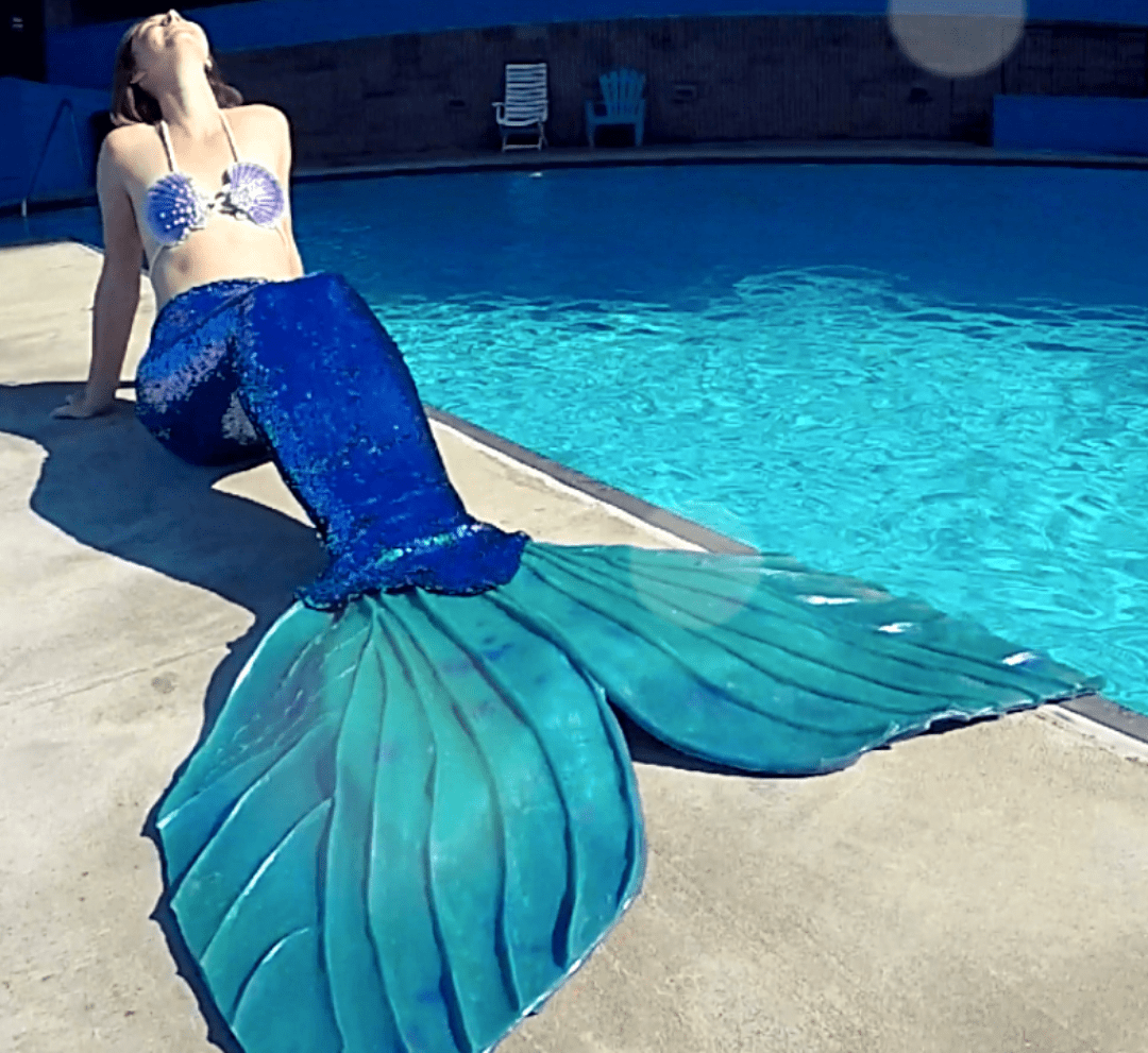 Sequin mermaid tail made with reversible mermaid sequin fabric. Teal blue and purple sequin mermaid tail