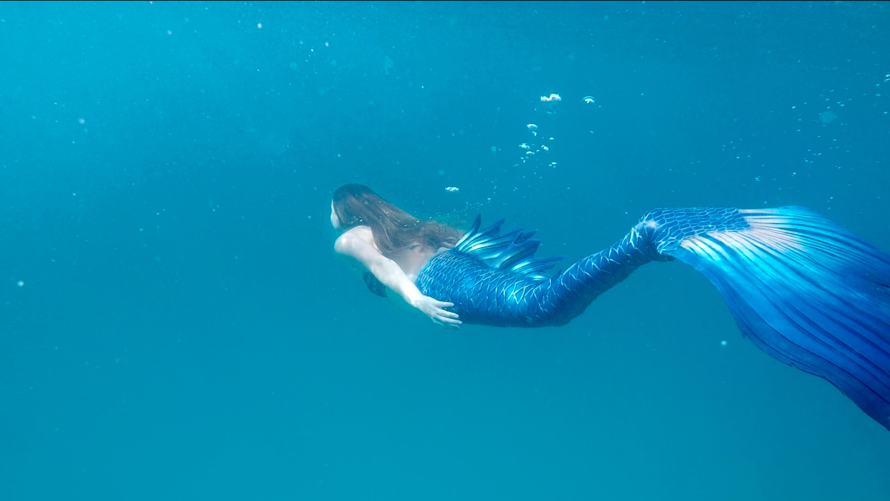 Mermaid swimming underwater